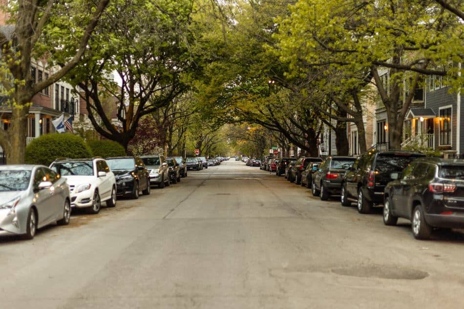 Cars parked at the side of the road.