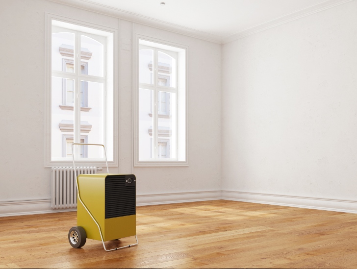 A dehumidifier in a empty room.
