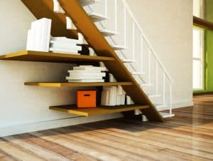 Books under the stairs.