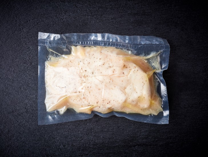 A chicken on a vacuum sealed bag.