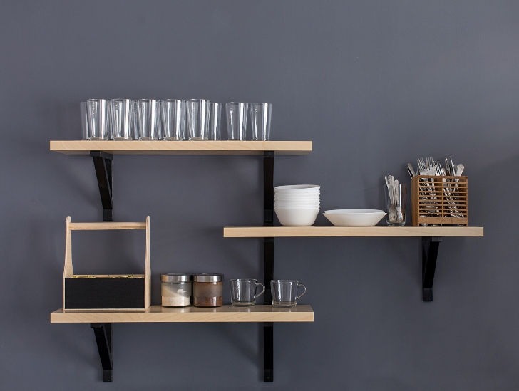 Hangging shelves with cup, plates, utensils and coffee.