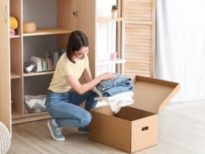 A woman organizing her wardrobe.